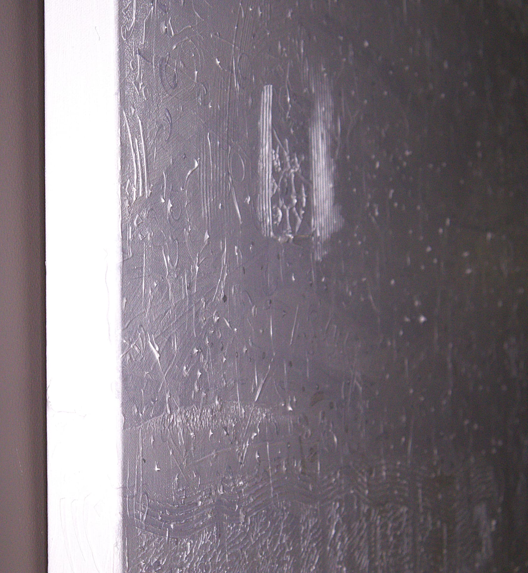 Rabbit — close-up detail of raking light across raised white impasto and incised marks