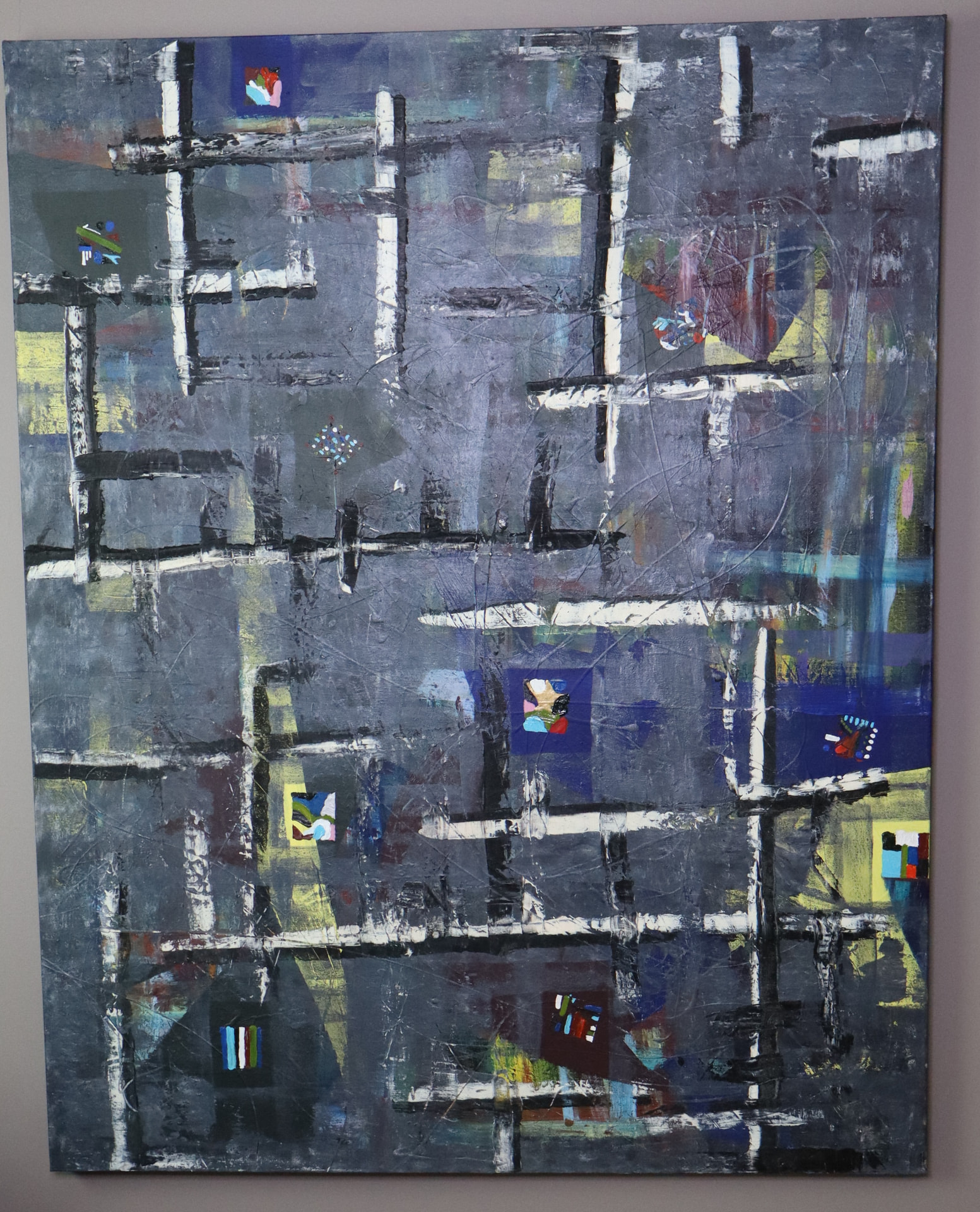 Laws — dark grid-like abstract painting in deep grays and blacks with small color accents
