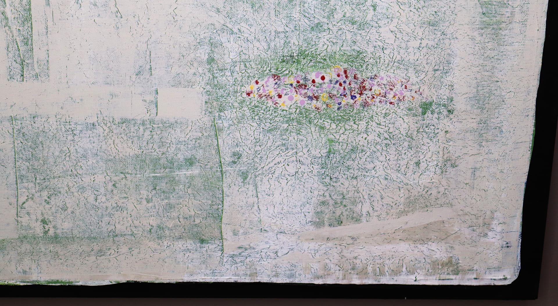 Spring — close-up detail of luminous flower-like accents emerging through pale green and white texture