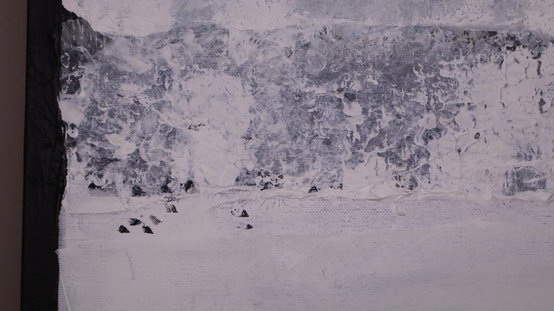 Winter — close-up detail of heavily textured white and gray layers above a pale field