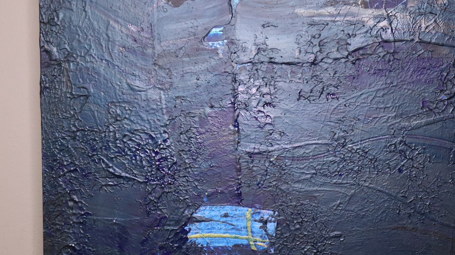 Dorathy — close-up detail showing cracked texture, violet layers, and a small blue-and-gold cross